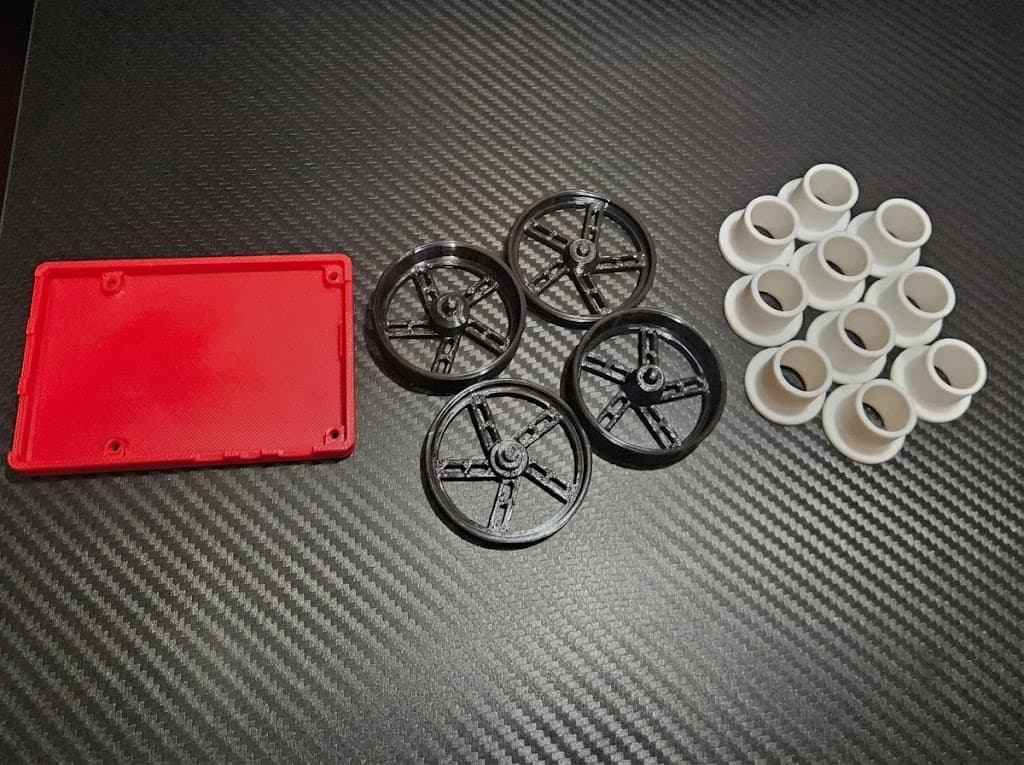 Assorted 3D-printed prototypes and batch parts in different colors